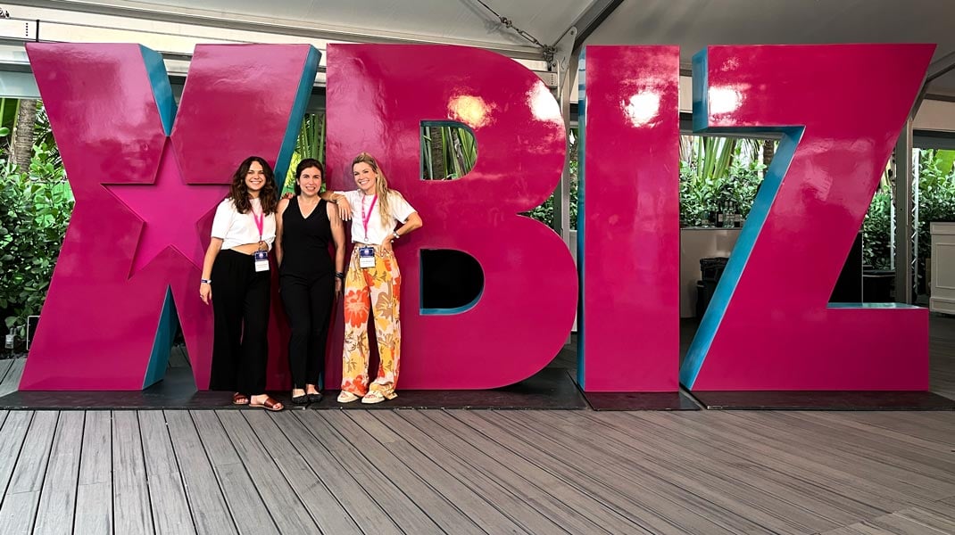 DSW Executive Assistant Maddy Kammeraad-Campbell, Director of Communications Ariela Moscowitz, and Development Manager Esmé Bengtson attend XBIZ Miami to connect with other industry professionals.