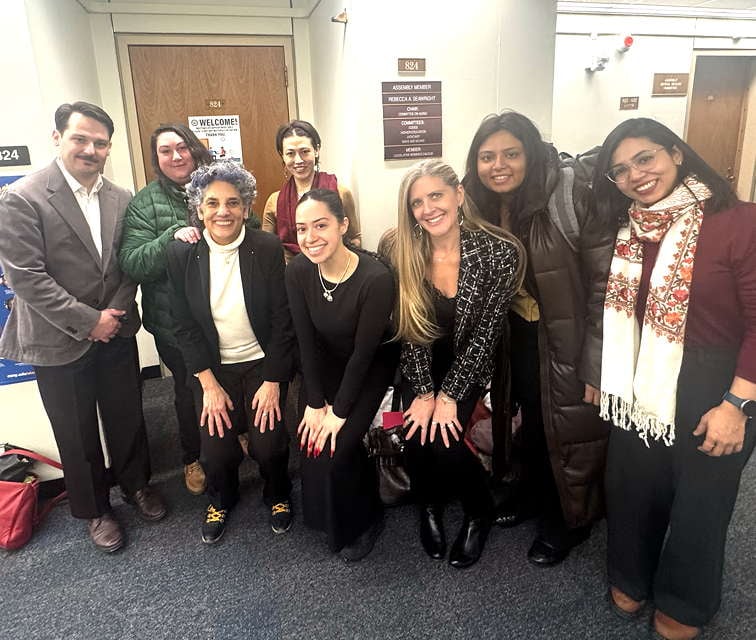 A.S.H. advocates pose with Assemblymember Rebecca Seawright outside her Albany office.