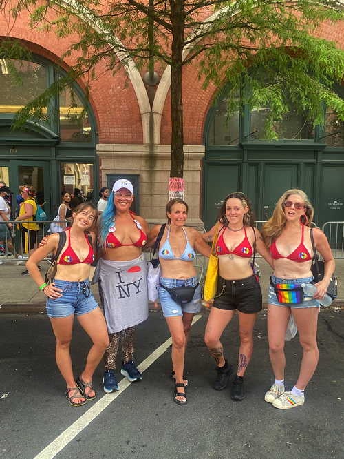 DSW’s Frances Steele, J. Leigh Oshiro-Brantly, Allison Kolins, Rebecca Cleary, and Melissa Broudo celebrate the conclusion of the Heritage Pride March (DSW 2021)