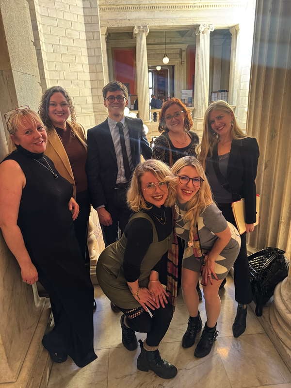 Staff poses with other advocates who testified in support of decriminalization at the Rhode Island State House.
